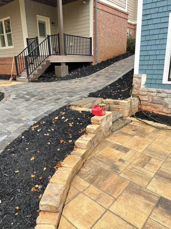 Residential landscape installation with fresh sod and beds